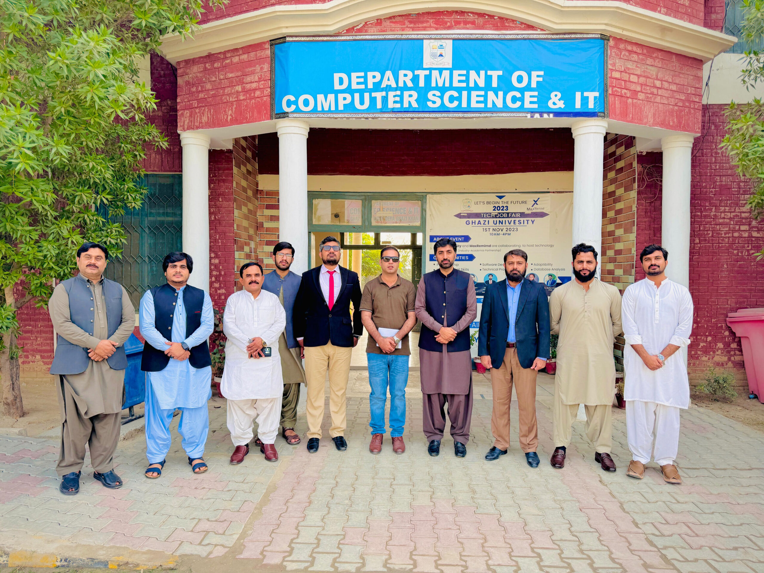 Group photo of Digital DGK team and university faculty in front of Computer Science & IT department